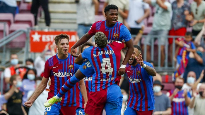 Barcelonas Ansu Fati celebrates after scoring his sides third goal during a Spanish La Liga soccer match between FC Barcelona and Levante at the Camp Nou stadium in Barcelona, Spain, Sunday, Sept. 26, 2021. (AP Photo/Joan Monfort)