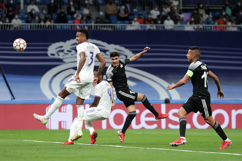 MADRID, SPAIN - SEPTEMBER 28: Jasurbek Yakhshiboev of Sheriff Tiraspol scores their side's first goal during the UEFA Champions League group D match between Real Madrid and FC Sheriff at Estadio Santiago Bernabeu on September 28, 2021 in Madrid, Spain. (Photo by Gonzalo Arroyo Moreno/Getty Images)
