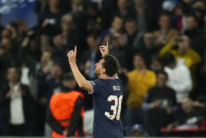 PSGs Lionel Messi celebrates after scoring his sides second goal during the Champions League Group A soccer match between Paris Saint-Germain and Manchester City at the Parc des Princes in Paris, Tuesday, Sept. 28, 2021. (AP Photo/Christophe Ena)