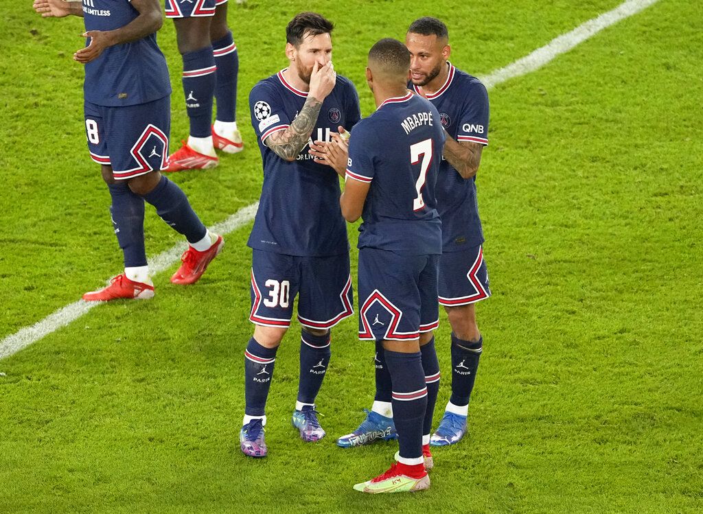 PSG's Lionel Messi, left, Kylian Mbappe, and Neymar, right, react following their win in their Champions League Group A soccer match against Manchester City at the Parc des Princes in Paris, Tuesday, Sept. 28, 2021. (AP Photo/Michel Euler)