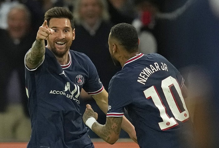 PSGs Lionel Messi, left, celebrates with Neymar after scoring his sides second goal during the Champions League Group A soccer match between Paris Saint-Germain and Manchester City at the Parc des Princes in Paris, Tuesday, Sept. 28, 2021. (AP Photo/Christophe Ena)