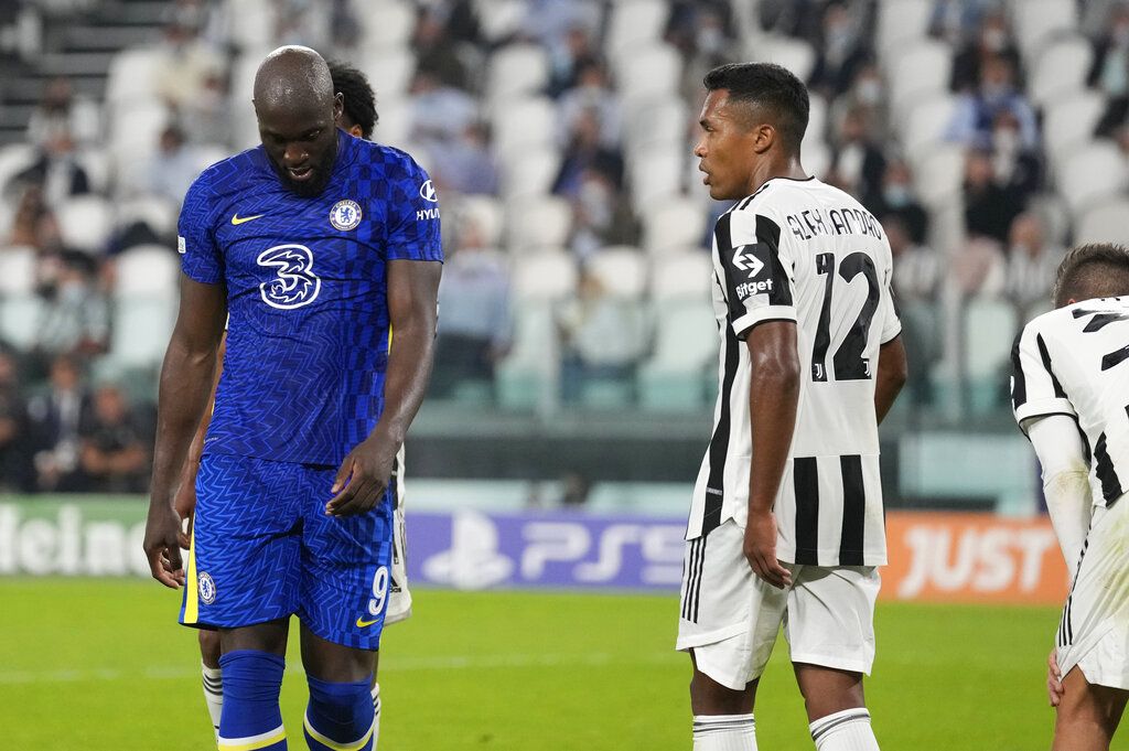 Chelsea's Romelu Lukaku, left, reacts after missing a scoring chance during the Champions League group H soccer match between Juventus and Chelsea at the Allianz stadium in Turin, Italy, Wednesday, Sept. 29, 2021. (AP Photo/Antonio Calanni)