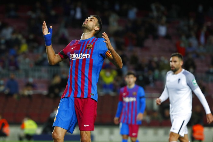 Barcelonas Sergio Busquets reacts after missing an opportunity to score during the Spanish La Liga soccer match between Barcelona and Granada, at the Camp Nou stadium in Barcelona, Spain, Monday, Sept. 20, 2021. (AP Photo/Joan Monfort)