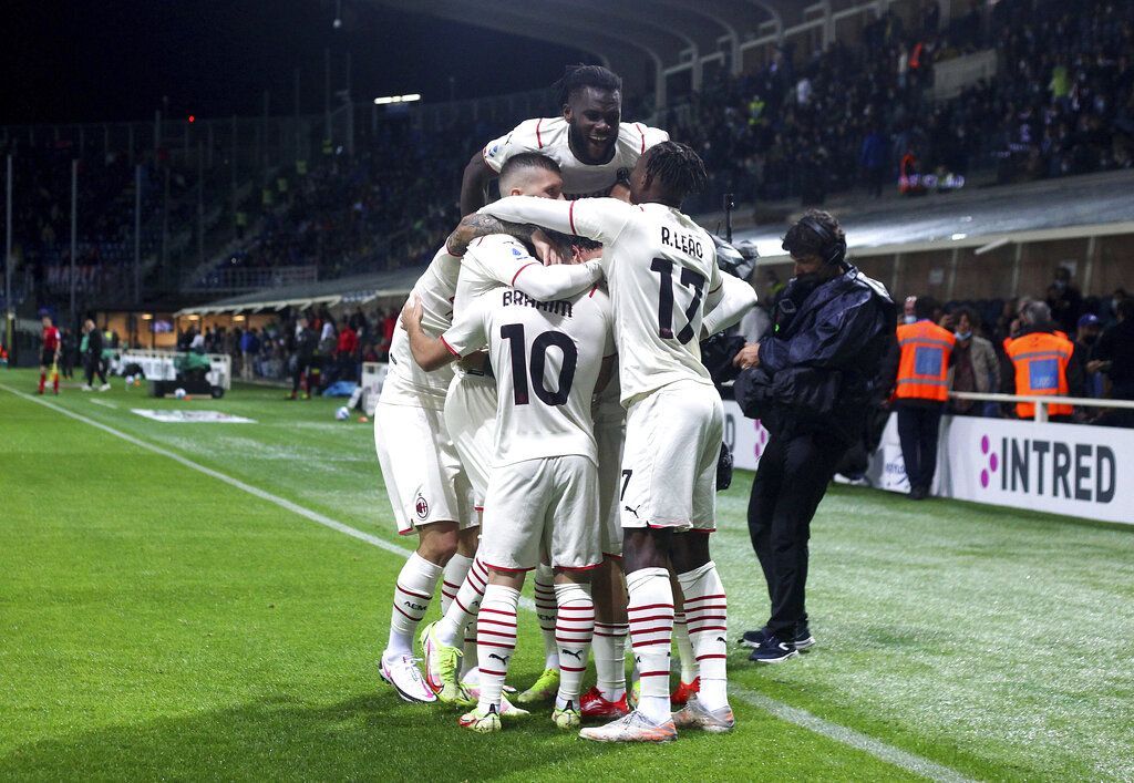 AC Milan's Davide Calabria celebrates with teammates after scoring his side's opening goal during the Serie A soccer match between Atalanta and AC Milan, at the Gewiss stadium in Bergamo, Italy, Saturday, Oct. 3, 2021. (Spada/LaPresse via AP)