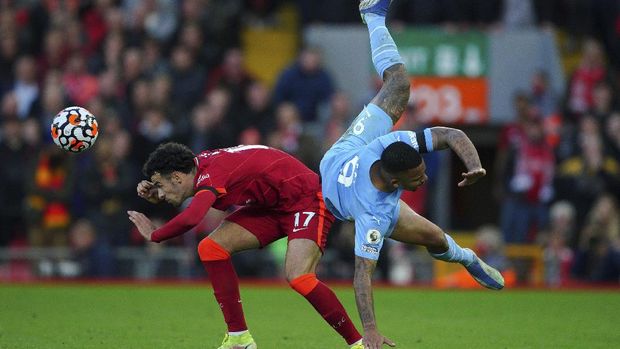 Liverpool's Curtis Jones left, and Manchester City's Gabriel Jesus battle for the ball  during the English Premier League soccer match between Liverpool and Manchester City at Anfield, Liverpool, England, Sunday Oct. 3, 2021. (Peter Byrne/PA via AP)