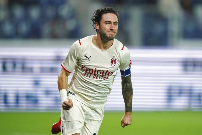 AC Milans Davide Calabria celebrates scoring his sides opening goal during the Serie A soccer match between Atalanta and AC Milan, at the Gewiss stadium in Bergamo, Italy, Saturday, Oct. 3, 2021. (Spada/LaPresse via AP)