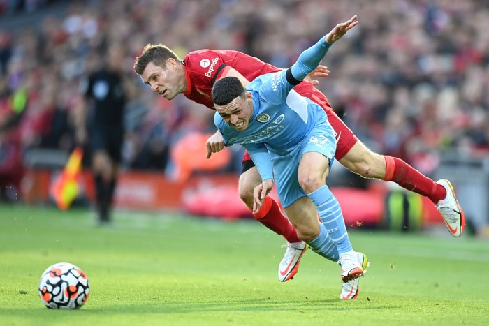 James Milner LIVERPOOL, ENGLAND - OCTOBER 03: Phil Foden of Manchester City breaks away from James Milner of Liverpool during the Premier League match between Liverpool and Manchester City at Anfield on October 03, 2021 in Liverpool, England. (Photo by Michael Regan/Getty Images)