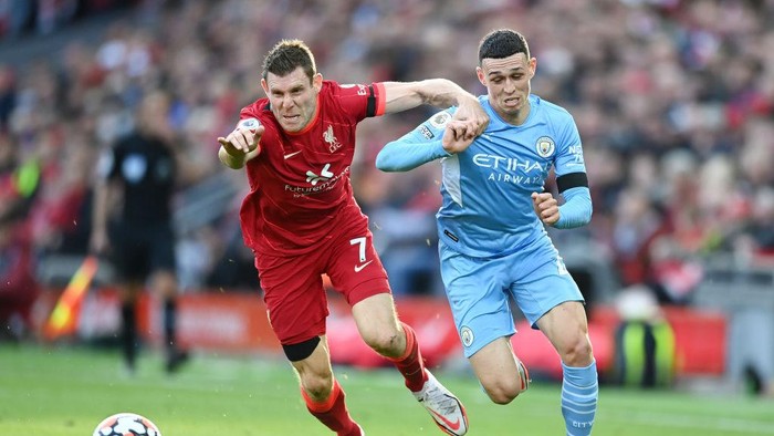 James Milner LIVERPOOL, ENGLAND - OCTOBER 03: Phil Foden of Manchester City breaks away from James Milner of Liverpool during the Premier League match between Liverpool and Manchester City at Anfield on October 03, 2021 in Liverpool, England. (Photo by Michael Regan/Getty Images)