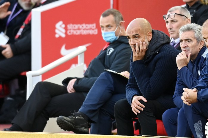 LIVERPOOL, ENGLAND - OCTOBER 03: Pep Guardiola, Manager of Manchester City reacts during the Premier League match between Liverpool and Manchester City at Anfield on October 03, 2021 in Liverpool, England. (Photo by Michael Regan/Getty Images)