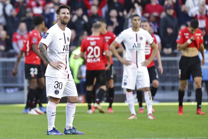 PSGs Lionel Messi, left, reacts during the French League One soccer match between Rennes and Paris Saint-Germain at the Roazhon Park stadium in Rennes, France, Sunday, Oct. 3, 2021. (AP Photo/Jeremias Gonzales)