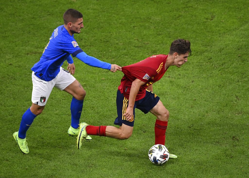 Spain's Gavi controls the ball during the UEFA Nations League semifinal soccer match between Italy and Spain at the San Siro stadium, in Milan, Italy, Wednesday, Oct. 6, 2021. (AP Photo/Antonio Calanni)