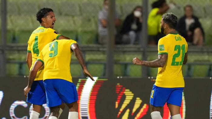 Brazils Marquinhos, left, celebrates with teammates after scoring his sides second goal against Venezuela during a qualifying soccer match for the FIFA World Cup Qatar 2022 at UCV Olympic Stadium in Caracas, Venezuela, Thursday, Oct.7, 2021. (AP Photo/Ariana Cubillos)