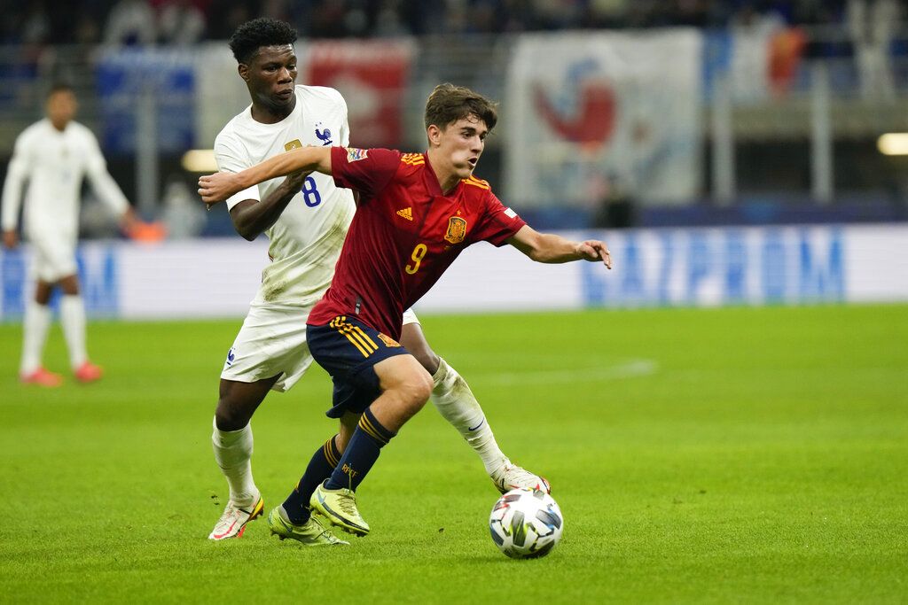 France's Aurelien Tchouameni, left, and Spain's Gavi vie for the ball during the UEFA Nations League final soccer match between France and Spain at the San Siro stadium, in Milan, Italy, Sunday, Oct. 10, 2021. (AP Photo/Luca Bruno)