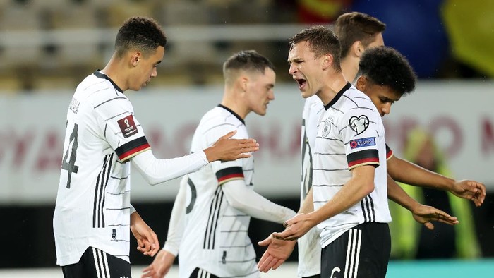 SKOPJE, MACEDONIA - OCTOBER 11: Jamal Musiala of Germany  celebrates with Joshua Kimmich after scoring their team's fourth goal during the 2022 FIFA World Cup Qualifier match between North Macedonia and Germany at National Arena Todor Proeski on October 11, 2021 in Skopje, Macedonia. (Photo by Alex Grimm/Getty Images)