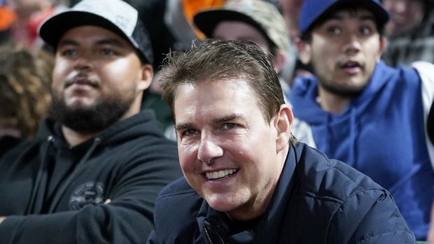 Actor Tom Cruise smiles during Game 2 of a baseball National League Division Series between the San Francisco Giants and the Los Angeles Dodgers Saturday, Oct. 9, 2021, in San Francisco. (AP Photo/Jeff Chiu)