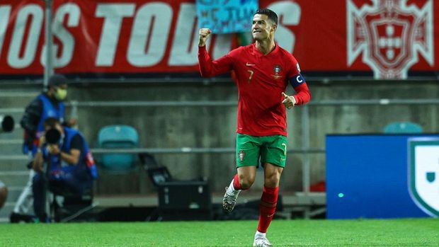 FARO, PORTUGAL - OCTOBER 12: Cristiano Ronaldo of Manchester United and Portugal celebrates scoring Portugal first goal during the 2022 FIFA World Cup Qualifier match between Portugal and Luxembourg at Estadio Algarve on October 12, 2021 in Faro, Faro. (Photo by Carlos Rodrigues/Getty Images)