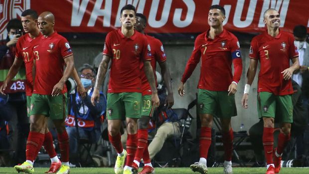 Portugal's Cristiano Ronaldo, 2nd right, smiles after scoring his side's fifth goal during the World Cup 2022 group A qualifying soccer match between Portugal and Luxembourg at the Algarve stadium outside Faro, Portugal, Tuesday, Oct. 12, 2021. (AP Photo/Joao Matos)