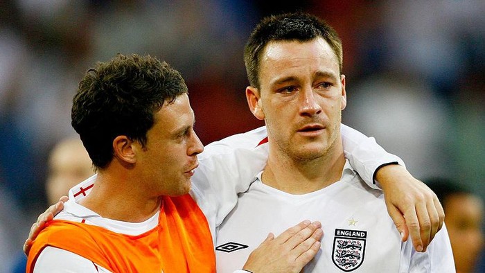GELSENKIRCHEN, GERMANY - JULY 01: Wayne Bridge consoles England team mate John Terry following defeat during the FIFA World Cup Germany 2006 Quarter-final match between England and Portugal played at the Stadium Gelsenkirchen on July 1, 2006 in Gelsenkirchen, Germany. (Photo by Shaun Botterill/Getty Images)