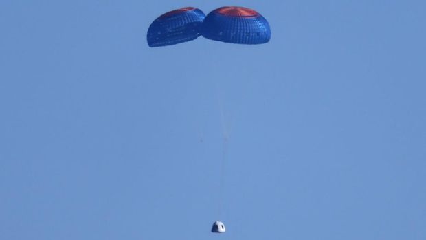 The capsule of Blue Origin's rocket New Shepard returns by parachute carrying Star Trek actor William Shatner, 90, and 3 other crew after billionaire Jeff Bezos's company's second suborbital tourism flight near Van Horn, Texas, U.S., October 13, 2021. REUTERS/Mike Blake