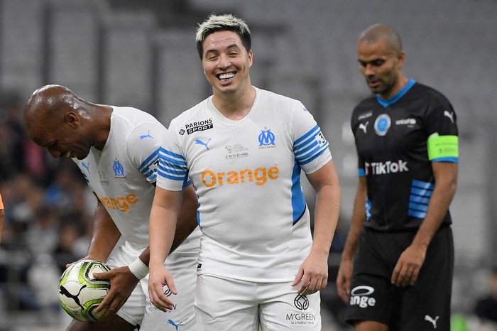 French former player Samir Nasri reacts during the charity 