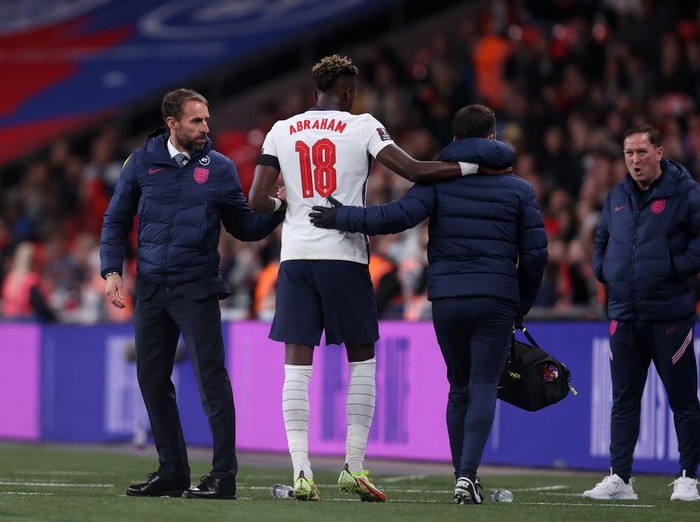 LONDON, ENGLAND - OCTOBER 12: Tammy Abraham of England leaves the pitch to receive medical attention during the 2022 FIFA World Cup Qualifier match between England and Hungary at Wembley Stadium on October 12, 2021 in London, England. (Photo by Julian Finney/Getty Images)