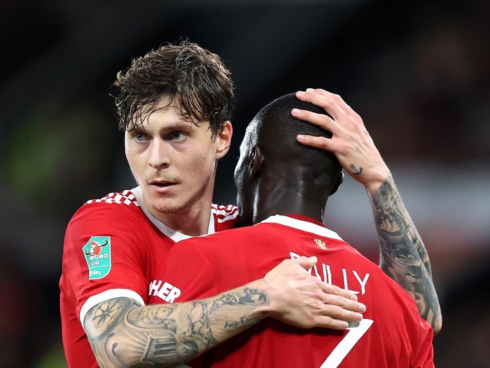 MANCHESTER, ENGLAND - SEPTEMBER 22: Victor Lindeloef of Manchester United interacts with teammate Eric Bailly during the Carabao Cup Third Round match between Manchester United and West Ham United at Old Trafford on September 22, 2021 in Manchester, England. (Photo by Alex Pantling/Getty Images)