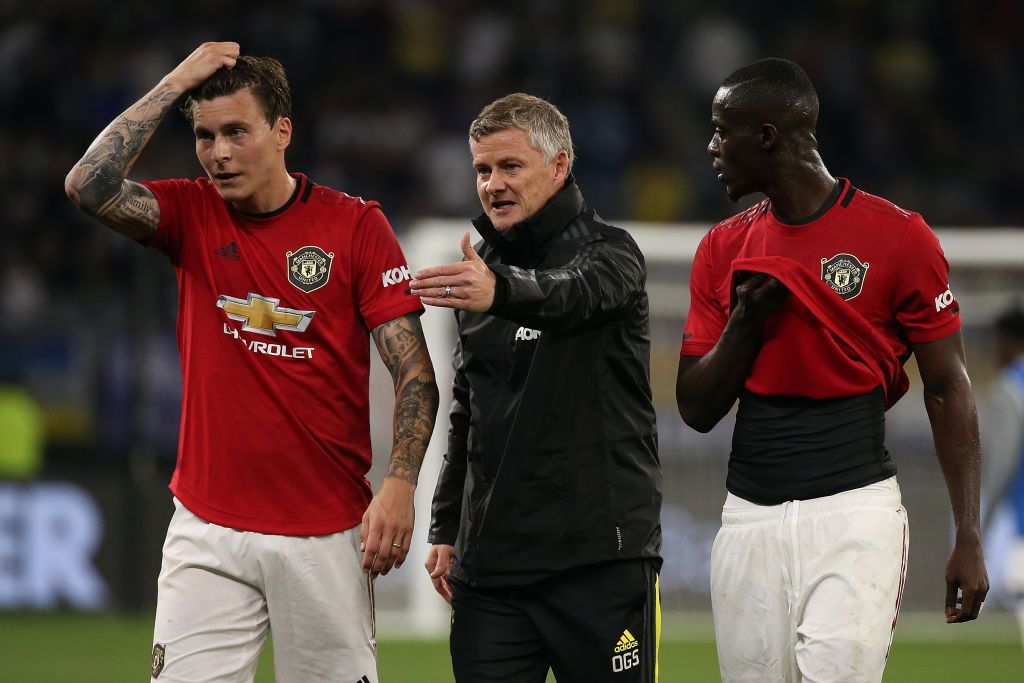 MANCHESTER, ENGLAND - SEPTEMBER 22: Victor Lindeloef of Manchester United interacts with teammate Eric Bailly during the Carabao Cup Third Round match between Manchester United and West Ham United at Old Trafford on September 22, 2021 in Manchester, England. (Photo by Alex Pantling/Getty Images)