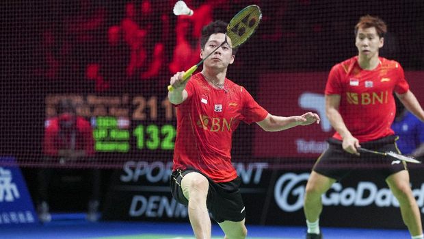 Marcus Fernaldi Gideon and Kevin Sanjaya Sukamuljo, of Indonesia, in action against Denmark's Kim Astrup and Anders Skaarup Rasmussen during the Thomas Cup men's double semifinal badminton match in Aarhus, Denmark, Saturday, Oct. 16, 2021. (Claus Fisker/Ritzau Scanpix via AP)