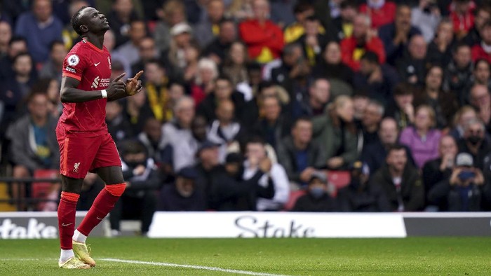 Liverpools Sadio Mane celebrates scoring their sides first goal of the game during the English Premier League soccer match between Watford and Liverpool at Vicarage Road, Watford, England, Saturday, Oct. 16, 2021. (Tess Derry/PA via AP)