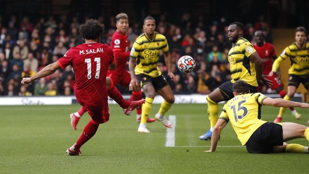 Soccer Football - Premier League - Watford v Liverpool - Vicarage Road, Watford, Britain - October 16, 2021 Liverpool's Mohamed Salah scores their fourth goal REUTERS/Andrew Couldridge EDITORIAL USE ONLY. No use with unauthorized audio, video, data, fixture lists, club/league logos or 'live' services. Online in-match use limited to 75 images, no video emulation. No use in betting, games or single club /league/player publications.  Please contact your account representative for further details.