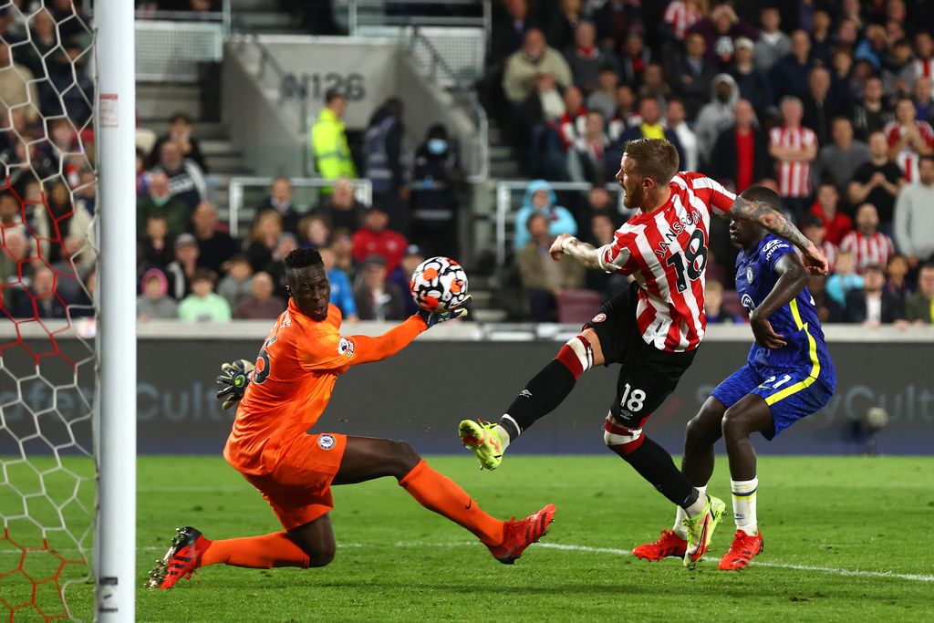BRENTFORD, ENGLAND - OCTOBER 16: Pontus Jansson of Brentford has his shot saved by Edouard Mendy of Chelsea during the Premier League match between Brentford and Chelsea at Brentford Community Stadium on October 16, 2021 in Brentford, England. (Photo by Clive Rose/Getty Images)