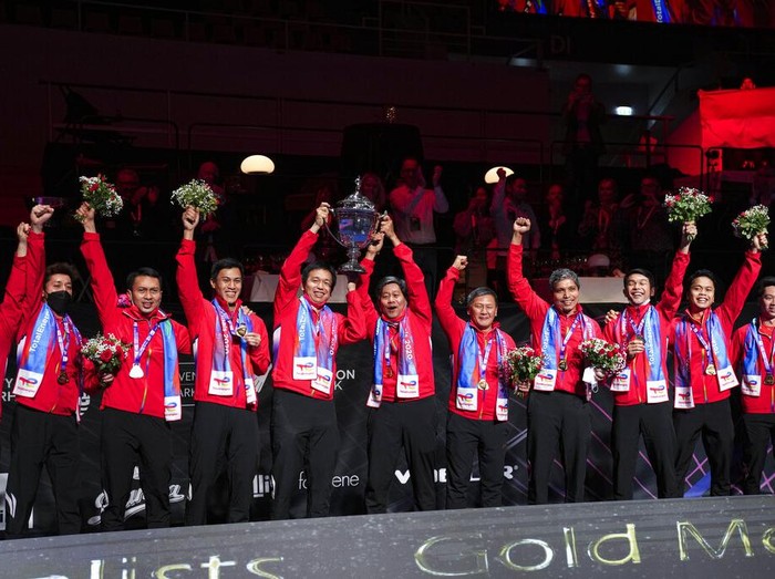 Players from Indonesia celebrates after winning the Thomas Cup mens team badminton tournament in Aarhus, Denmark, Sunday Oct. 17, 2021. (Claus Fisker/Ritzau Scanpix via AP)