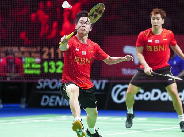 Marcus Fernaldi Gideon and Kevin Sanjaya Sukamuljo, of Indonesia, in action against Denmarks Kim Astrup and Anders Skaarup Rasmussen during the Thomas Cup mens double semifinal badminton match in Aarhus, Denmark, Saturday, Oct. 16, 2021. (Claus Fisker/Ritzau Scanpix via AP)