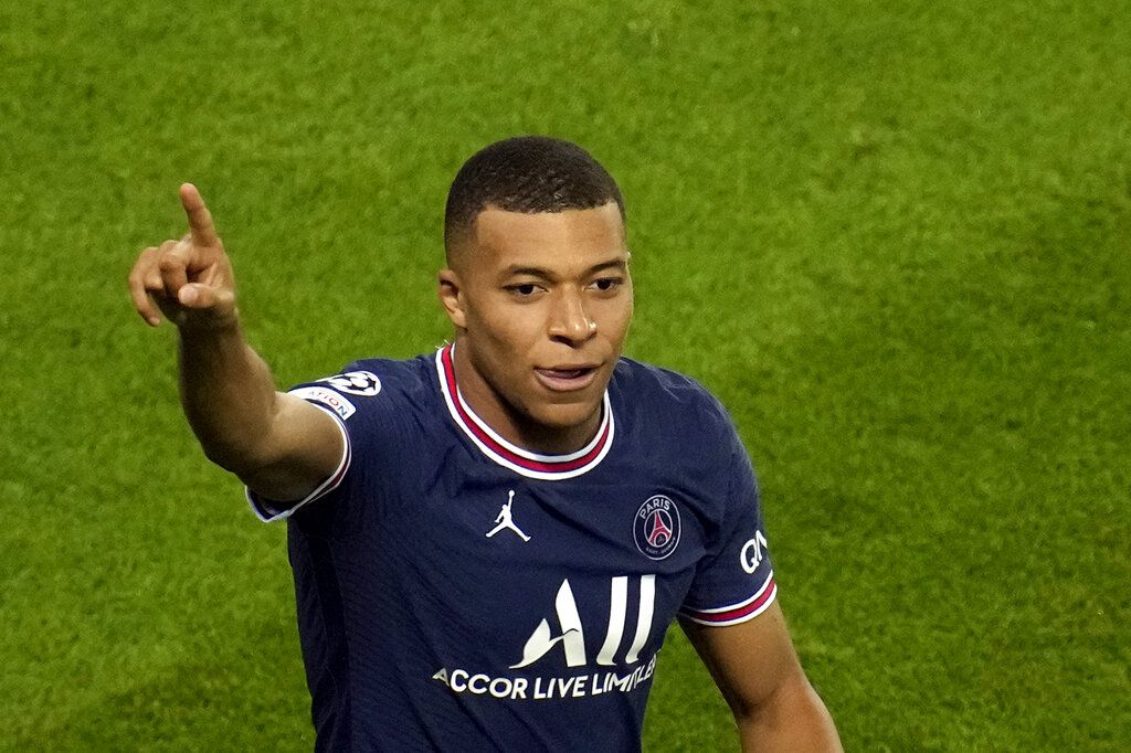 PSG's Kylian Mbappe celebrates after scoring his side's first goal during their Champions League soccer match between Paris Saint Germain and RB Leipzig at the Parc des Princes stadium in Paris, Tuesday, Oct. 19, 2021. (AP Photo/Christophe Ena)