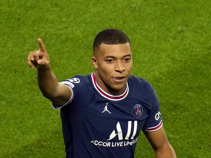 PSG's Kylian Mbappe celebrates after scoring his side's first goal during their Champions League soccer match between Paris Saint Germain and RB Leipzig at the Parc des Princes stadium in Paris, Tuesday, Oct. 19, 2021. (AP Photo/Christophe Ena)