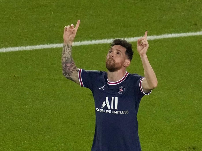 PSG's Lionel Messi celebrates after scoring his side's third goal during his Champions League soccer match between Paris Saint Germain and RB Leipzig at the Parc des Princes stadium in Paris, Tuesday, Oct. 19, 2021. (AP Photo/Christophe Ena)