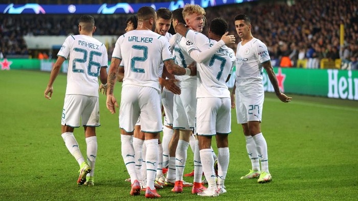 BRUGGE, BELGIUM - OCTOBER 19: Cole Palmer of Manchester City celebrates after scoring their sides fourth goal with team mates during the UEFA Champions League group A match between Club Brugge KV and Manchester City at Jan Breydel Stadium on October 19, 2021 in Brugge, Belgium. (Photo by Julian Finney/Getty Images)