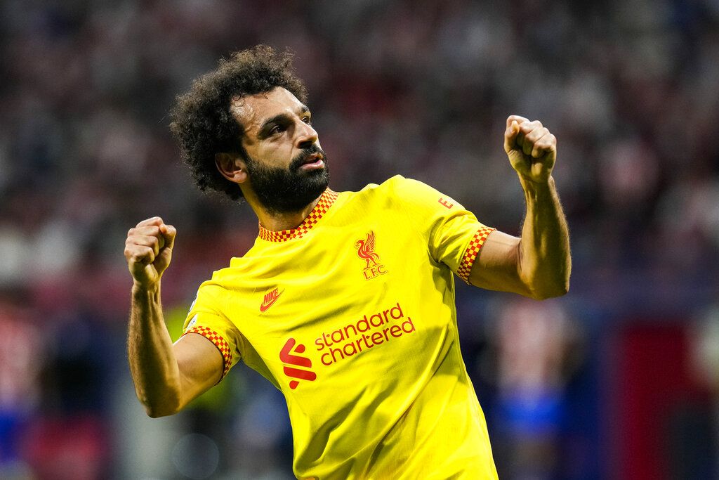 Liverpool's Mohamed Salah celebrates after scoring a penalty shot during the Champions League Group B soccer match between Atletico Madrid and Liverpool at Wanda Metropolitano stadium in Madrid, Spain, Tuesday, Oct. 19, 2021. (AP Photo/Manu Fernandez)