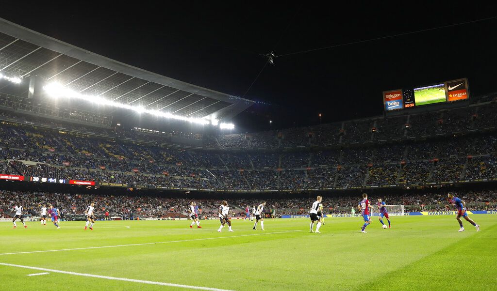 Barcelona's Gerard Pique, second from right, celebrates with his teammates after scoring his side's first goal during a Champions League group E soccer match between F.C. Barcelona and Dinamo Kyiv at Camp Nou stadium in Barcelona, Spain, Wednesday, Oct. 20, 2021. (AP Photo/Joan Monfort)