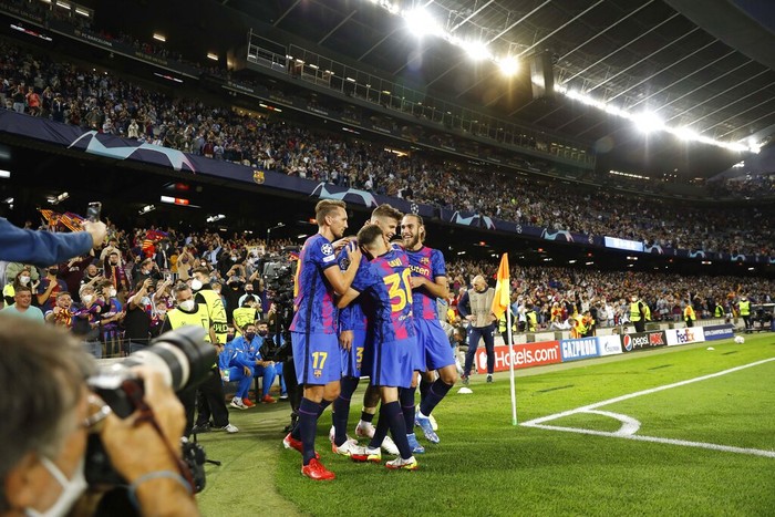 Barcelonas Gerard Pique, second from right, celebrates with his teammates after scoring his sides first goal during a Champions League group E soccer match between F.C. Barcelona and Dinamo Kyiv at Camp Nou stadium in Barcelona, Spain, Wednesday, Oct. 20, 2021. (AP Photo/Joan Monfort)