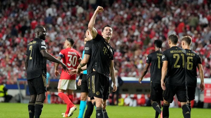 Bayerns Robert Lewandowski celebrates after scoring his sides third goal during the Champions League group E soccer match between Benfica and Bayern Munich at the Luz stadium in Lisbon, Wednesday, Oct. 20, 2021. (AP Photo/Armando Franca)