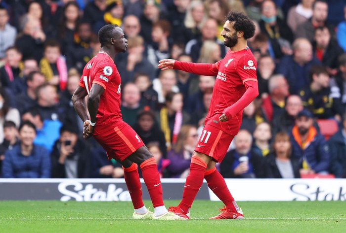 Mohamed Salah-Sadio Mane WATFORD, ENGLAND - OCTOBER 16: Sadio Mane of Liverpool celebrates with teammate Mohamed Salah after scoring their side's first goal during the Premier League match between Watford and Liverpool at Vicarage Road on October 16, 2021 in Watford, England. (Photo by Richard Heathcote/Getty Images)