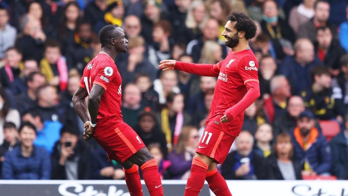 WATFORD, ENGLAND - OCTOBER 16: Sadio Mane of Liverpool celebrates with teammate Mohamed Salah after scoring their sides first goal during the Premier League match between Watford and Liverpool at Vicarage Road on October 16, 2021 in Watford, England. (Photo by Richard Heathcote/Getty Images)