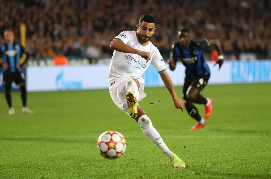 BRUGGE, BELGIUM - OCTOBER 19: Riyad Mahrez of Manchester City scores their side's second goal from the penalty spot during the UEFA Champions League group A match between Club Brugge KV and Manchester City at Jan Breydel Stadium on October 19, 2021 in Brugge, Belgium. (Photo by Julian Finney/Getty Images)