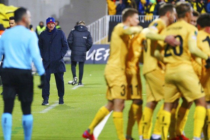 Roma coach Jose Mourinho watches Bodo Glimt's players celebrate during the Europa conference league soccer match between Bodo Glimt and Roma at Aspmyra stadium in Bodo, Norway, Thursday, Oct. 21, 2021. (Mats Torbergsen/NTB Scanpix via AP)