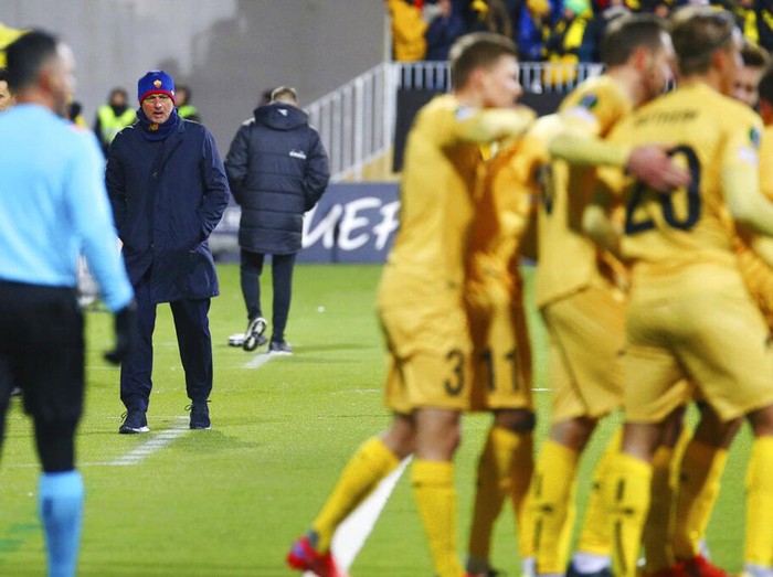 Roma coach Jose Mourinho watches Bodo Glimt's players celebrate during the Europa conference league soccer match between Bodo Glimt and Roma at Aspmyra stadium in Bodo, Norway, Thursday, Oct. 21, 2021. (Mats Torbergsen/NTB Scanpix via AP)