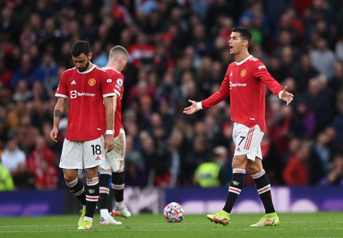 MANCHESTER, ENGLAND - OCTOBER 24: Cristiano Ronaldo of Manchester United reacts after their side concedes a third goal scored by Mohamed Salah of Liverpool (not pictured) during the Premier League match between Manchester United and Liverpool at Old Trafford on October 24, 2021 in Manchester, England. (Photo by Shaun Botterill/Getty Images)