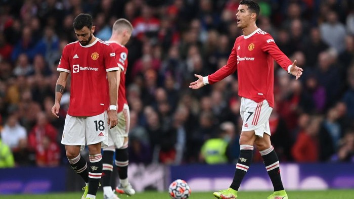 MANCHESTER, ENGLAND - OCTOBER 24: Cristiano Ronaldo of Manchester United reacts after their side concedes a third goal scored by Mohamed Salah of Liverpool (not pictured) during the Premier League match between Manchester United and Liverpool at Old Trafford on October 24, 2021 in Manchester, England. (Photo by Shaun Botterill/Getty Images)
