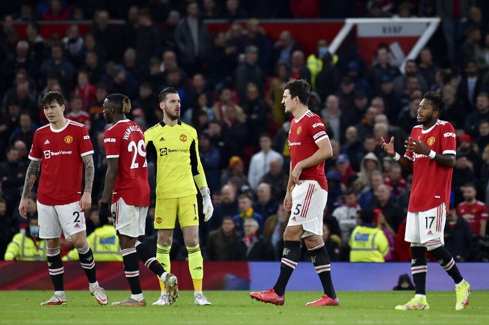Manchester United players react during the English Premier League soccer match between Manchester United and Liverpool at Old Trafford in Manchester, England, Sunday, Oct. 24, 2021. (AP Photo/Rui Vieira)