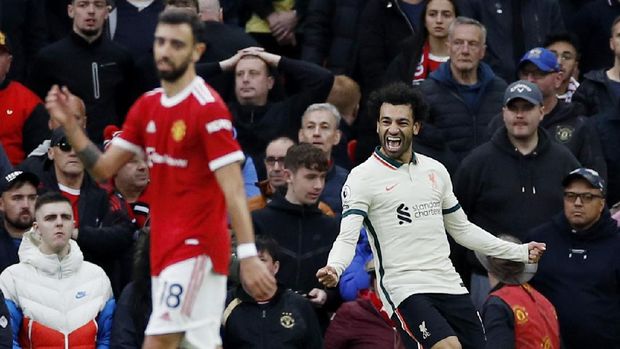 Soccer Football - Premier League - Manchester United v Liverpool - Old Trafford, Manchester, Britain - October 24, 2021 Liverpool's Mohamed Salah celebrates scoring their third goal REUTERS/Phil Noble EDITORIAL USE ONLY. No use with unauthorized audio, video, data, fixture lists, club/league logos or 'live' services. Online in-match use limited to 75 images, no video emulation. No use in betting, games or single club /league/player publications.  Please contact your account representative for further details.